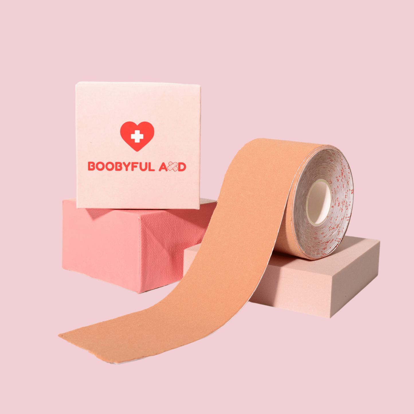 boobyful aid nude boob tape with two pink cubes 